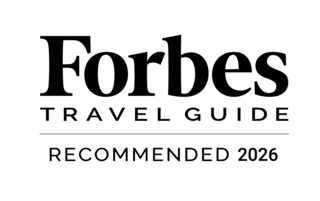 A simple black silhouette of a cat, sitting gracefully with its tail curled, exuding an elegant and tranquil vibe.